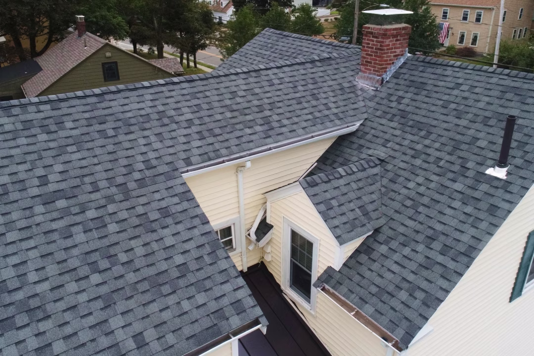 US Siding & Roofing, Painting and Windows team and work vehicle in Sudbury